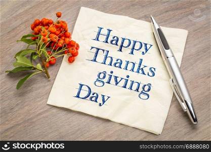 Happy Thanksgiving Day - handwriting on a napkin with firethorn berries
