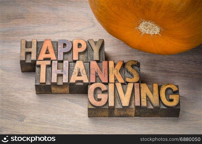 Happy Thanksgiving greeting card - typography in vintage letterpress wood type with a pumpkin