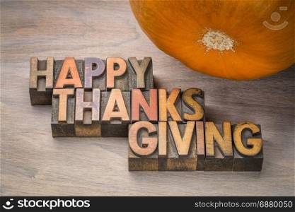 Happy Thanksgiving greeting card - typography in vintage letterpress wood type with a pumpkin