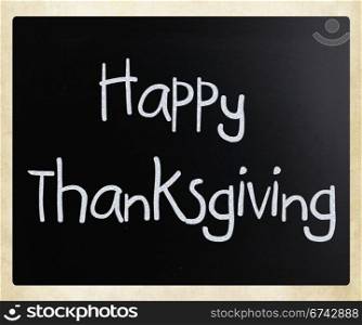 ""Happy Thanksgiving" handwritten with white chalk on a blackboard"
