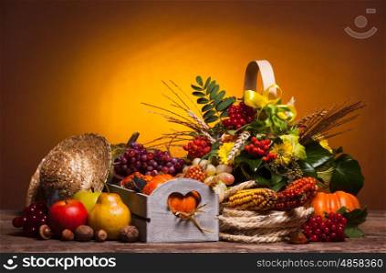 Happy Thanksgiving still life. Fruits, nuts and vegetables, fall crop on the table