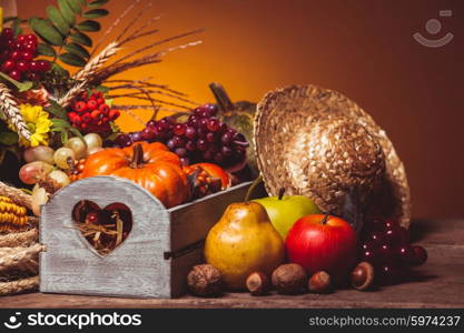 Happy Thanksgiving still life. Fruits, nuts and vegetables, fall crop on the table