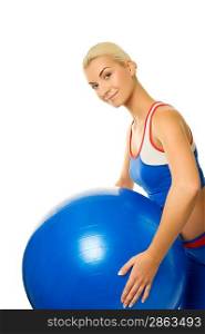 Happy trainer holding a fitness ball