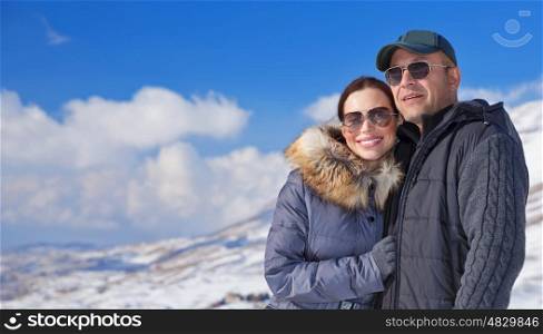Happy travelers enjoying snowy mountains, active lifestyle, winter season, beautiful nature, love and romance, wintertime vacation concept