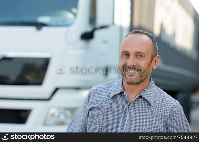 happy truck driver smiling at the camera
