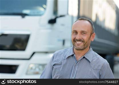 happy truck driver smiling at the camera