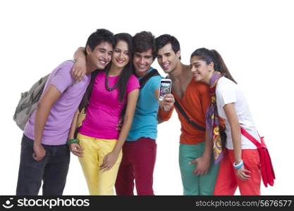 Happy university friends taking picture of themselves on white background