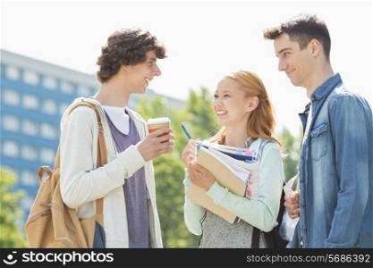 Happy university students conversing at campus