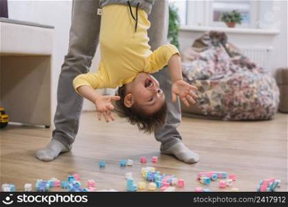 happy upside down child playing