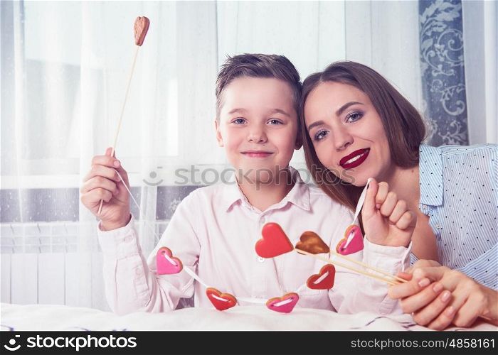 Happy Valentines Day, Mother day or Woman 8 march Day. Young boy spend time with his mum and celebrate it