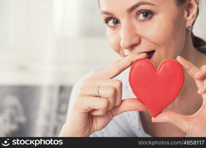 Happy Valentines or mother day. Young woman with gingerbread heart cookies. Illustrate of Happy Valentines Day or Mother day.