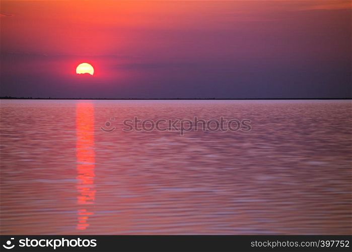 happy weekend by the sea. Ukrainian landscape and a beautiful sunset at the Sea of Azov, Ukraine