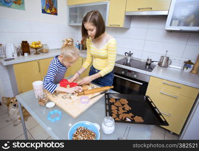 happy weekend - Sister girls cook a Linzer Cookies in the kitchen