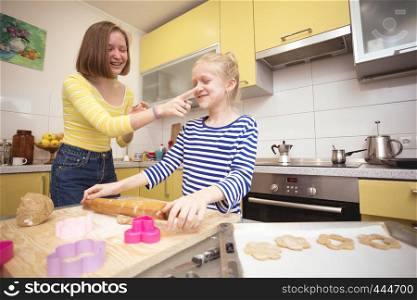 happy weekend - Sister girls cook a Linzer Cookies in the kitchen