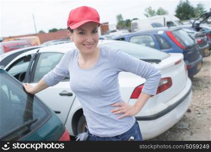 happy wiping car female worker on a car wash