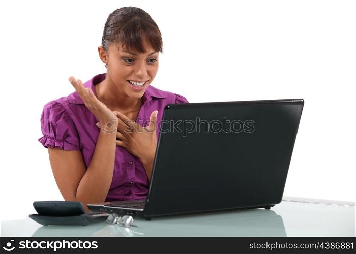 Happy woman at the computer