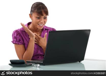 Happy woman at the computer