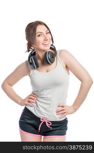 happy woman athlete with headphones on white background