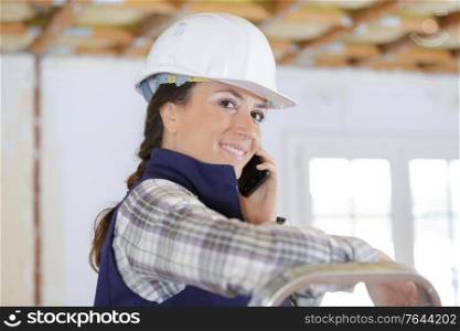 happy woman builder looking at camera
