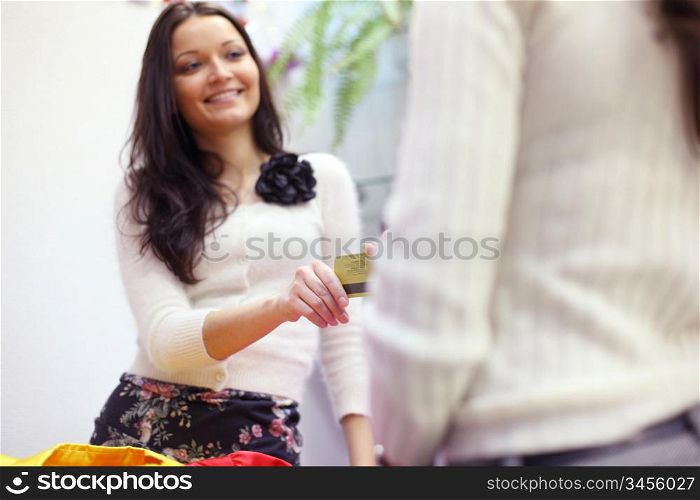 happy woman buy clothes in shop
