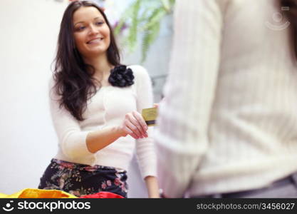 happy woman buy clothes in shop