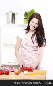 happy woman chopping tomato. happy woman chopping tomato for spaghetti