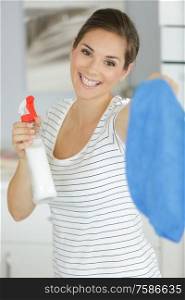 happy woman cleaning at home