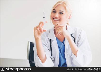 Happy woman doctor in hospital office. Medical concept.