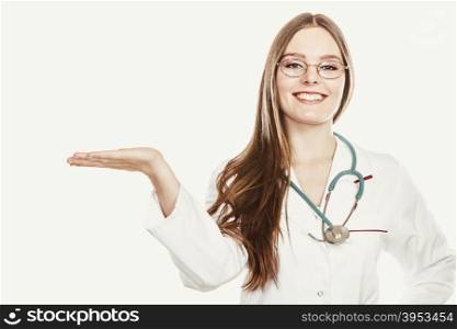 Happy woman doctor with empty hand palm copyspace.. Happy woman medical doctor with stethoscope wearing white coat holding empty palm hand for copyspace. Professional health care advertisement.
