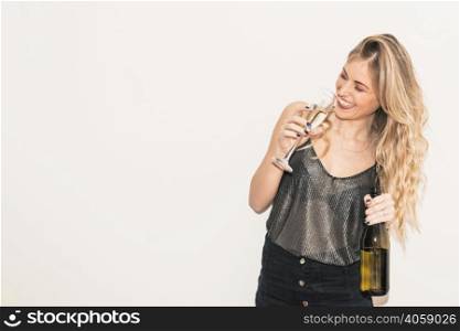 happy woman drinking champagne from glass
