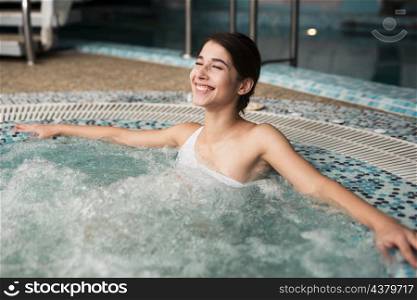 happy woman enjoying spa hot tub