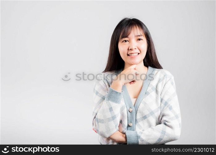 Happy woman hand touch chin handle relaxed thinking about something about the question, Portrait Asian beautiful young female idea think studio shot isolated on white background with copy space