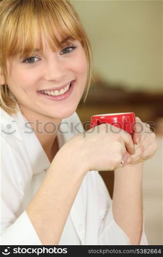 Happy woman having coffee