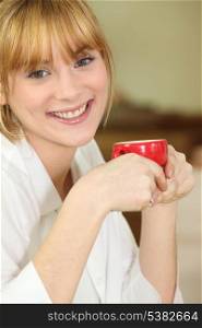 Happy woman having coffee