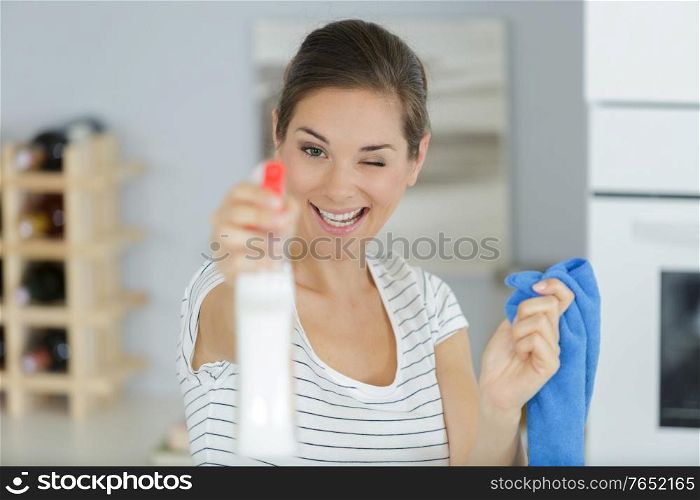 happy woman having fun while cleaning