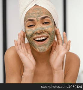 happy woman having homemade mask her face