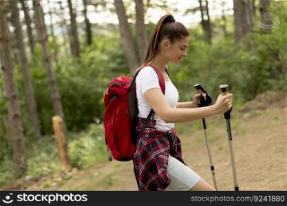 Happy woman hiking in the forest  mountain