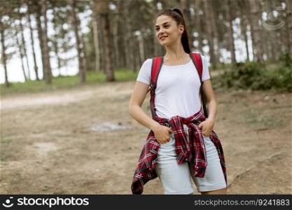 Happy woman hiking in the forest  mountain