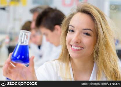 happy woman holding a substance