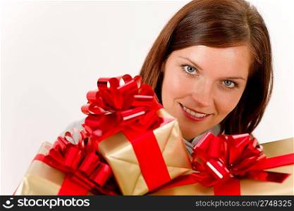 Happy woman holding Christmas presents on white background