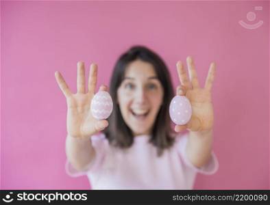 happy woman holding easter eggs