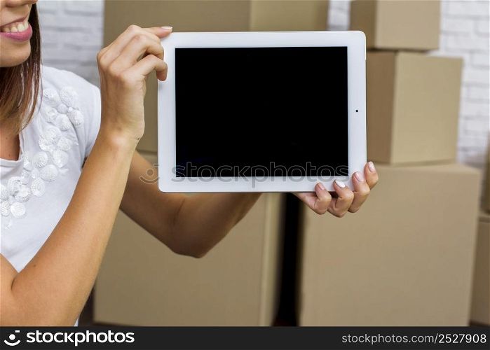happy woman holding tablet mockup
