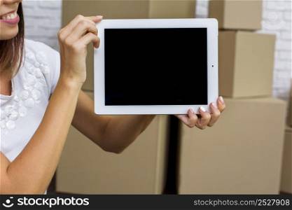 happy woman holding tablet mockup
