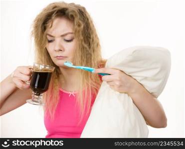 Happy woman holding toothbrush and coffee going to brush her teeth after hot drink.. Happy woman holding toothbrush and coffee