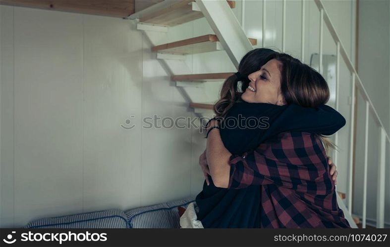 Happy woman, hugging her friend, grateful after having recovered. Happy woman hugging her friend