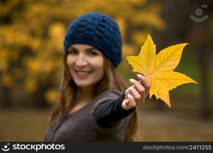 Happy woman in a beautiful autumn day