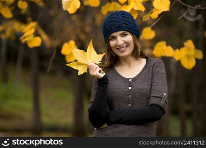Happy woman in a beautiful autumn day