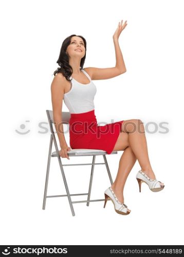 happy woman in blank white t-shirt on a chair