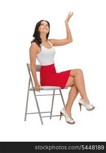happy woman in blank white t-shirt on a chair