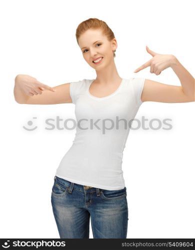 happy woman in blank white t-shirt pointing at herself